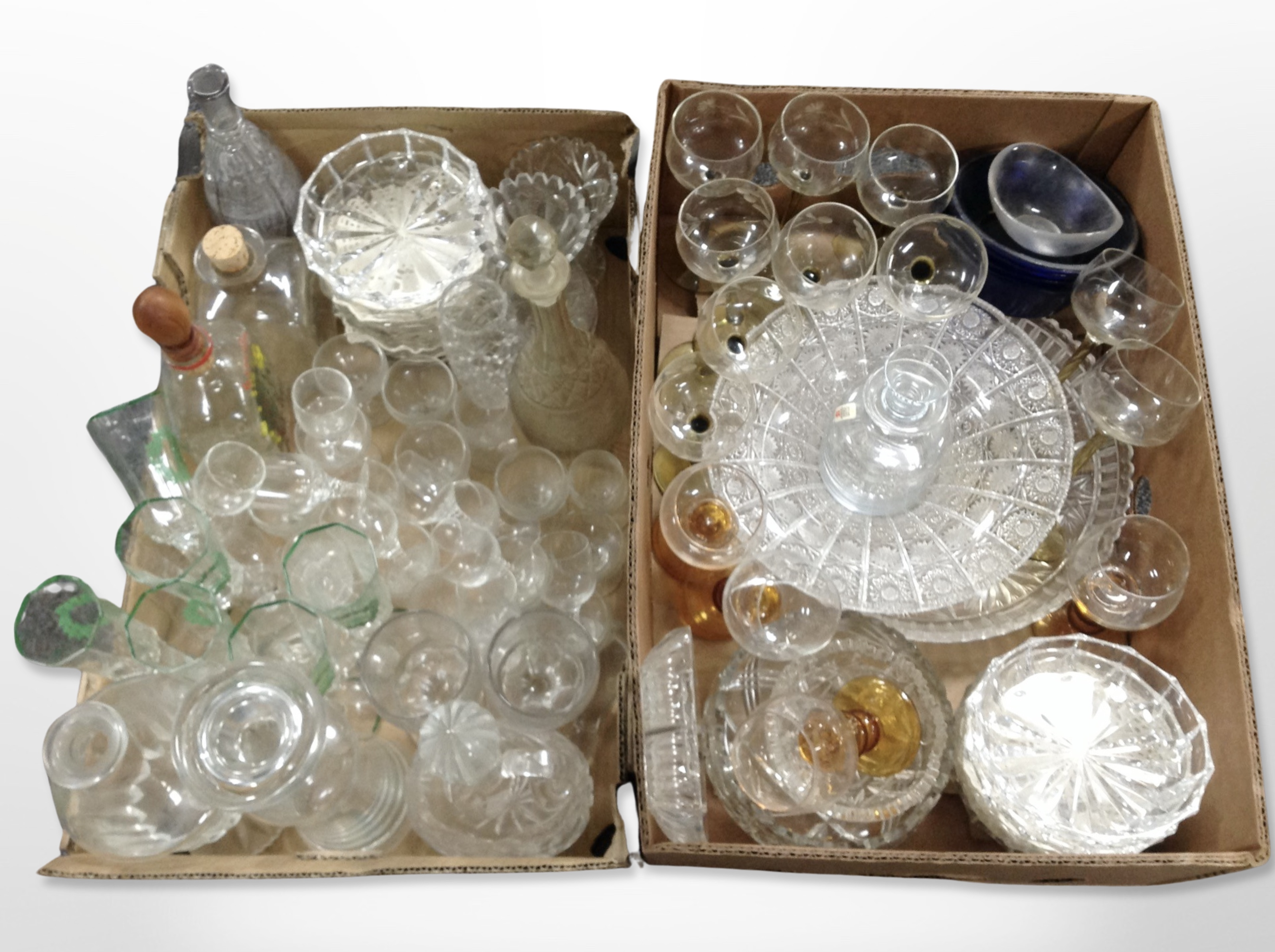 Assorted 20th-century glass wares including continental decanters, etched drinking glasses, bowls,