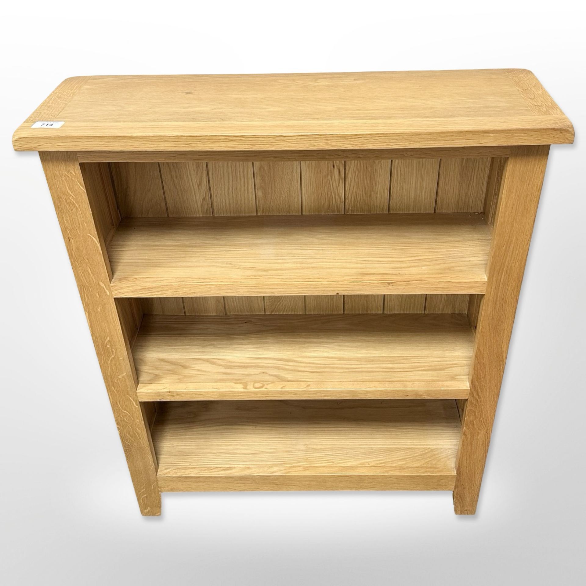 A contemporary oak bookcase, 70cm wide x 83cm high x 23cm deep.