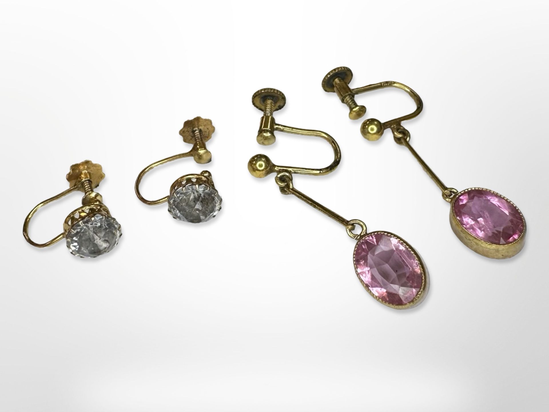 Two pairs of yellow metal earrings set with semi-precious stones.