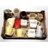 A collection of ceramic whisky jugs bearing various advertising.