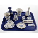 A group of Wedgwood blue and white Jasperware including vases, urns, dishes, two Wedgwood plaques.