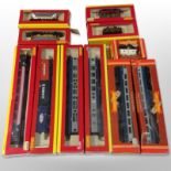 A group of Hornby 00 gauge locomotives, passenger cars and tenders,