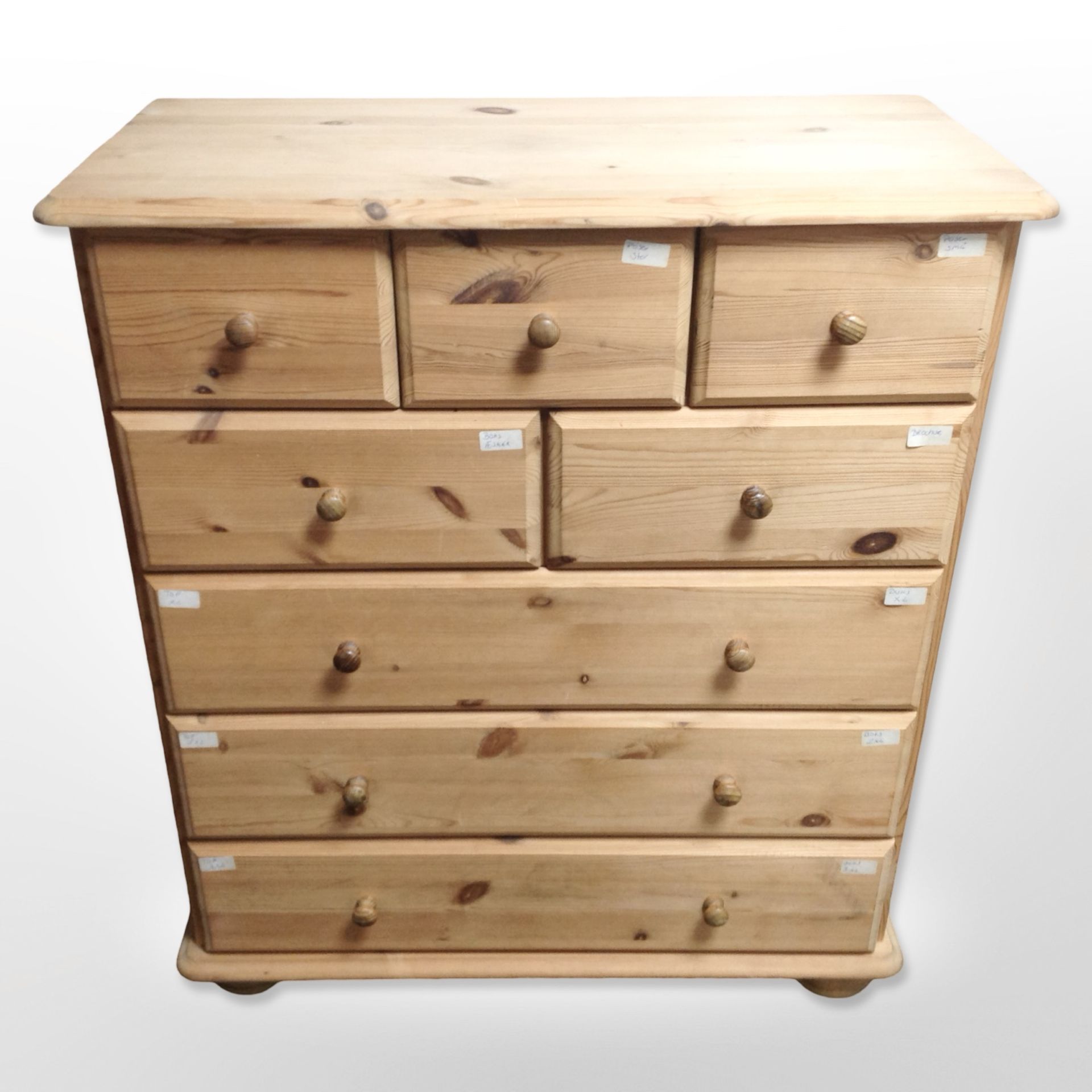 A contemporary pine chest of eight drawers,