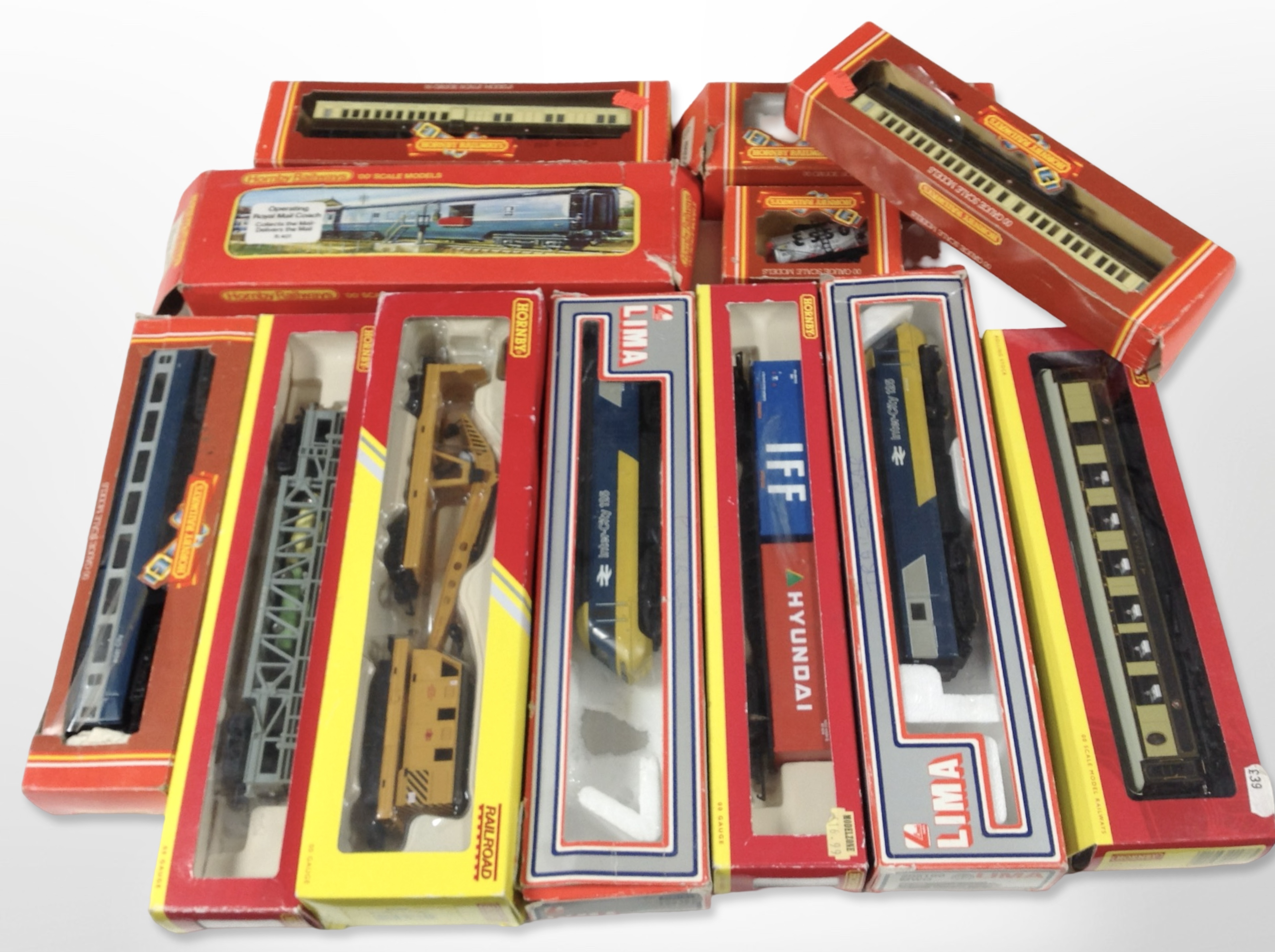 A collection of Hornby and Lima 00 gauge locomotives, passenger cars and tenders, all boxed.