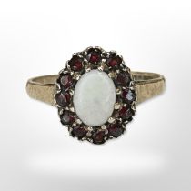 A 9ct yellow gold opal and garnet cluster ring, size O CONDITION REPORT: 2.2g.