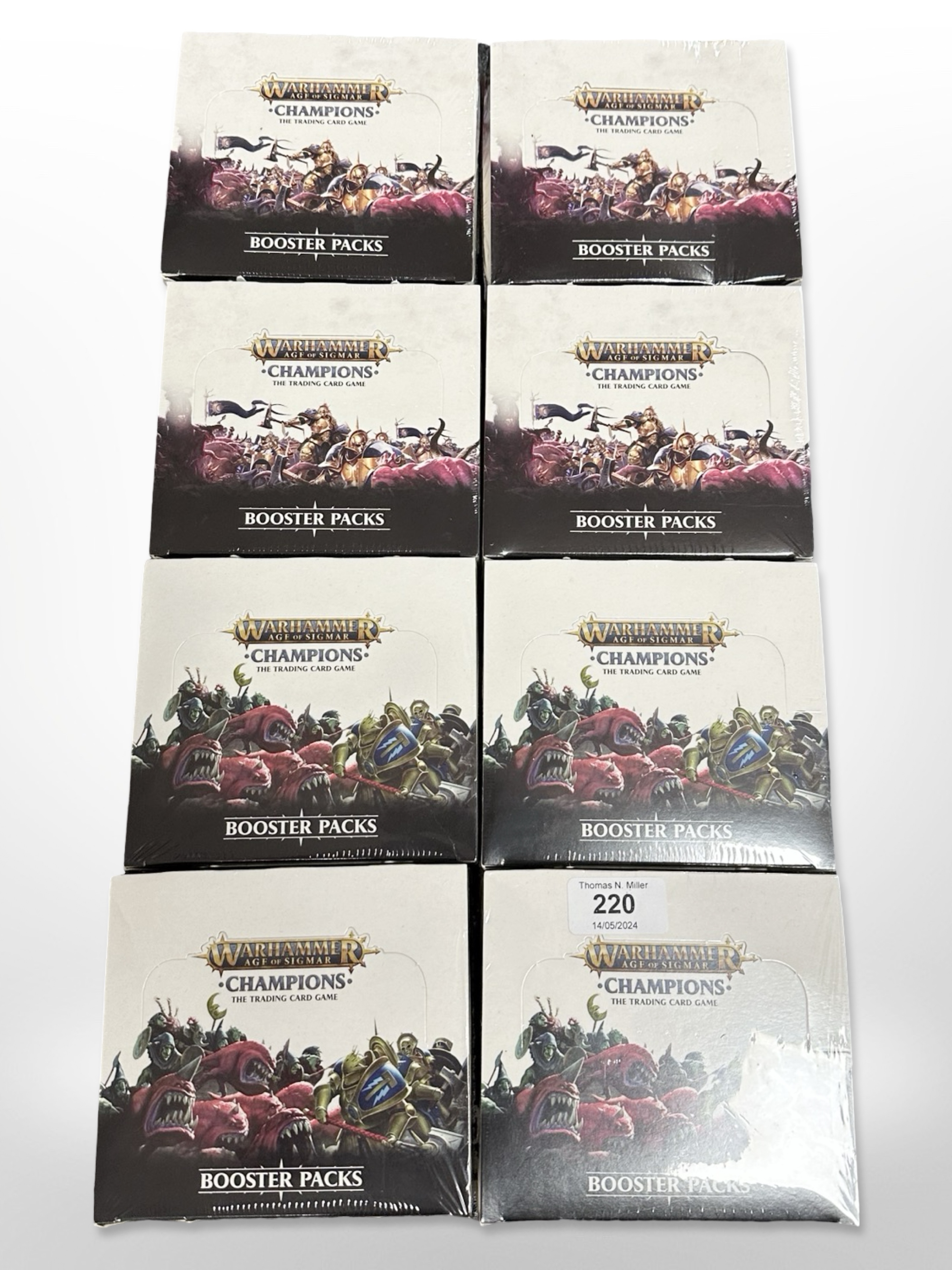 Eight Warhammer Age of Sigmar Champions Trading Card Game booster sets, all sealed in cellophane.