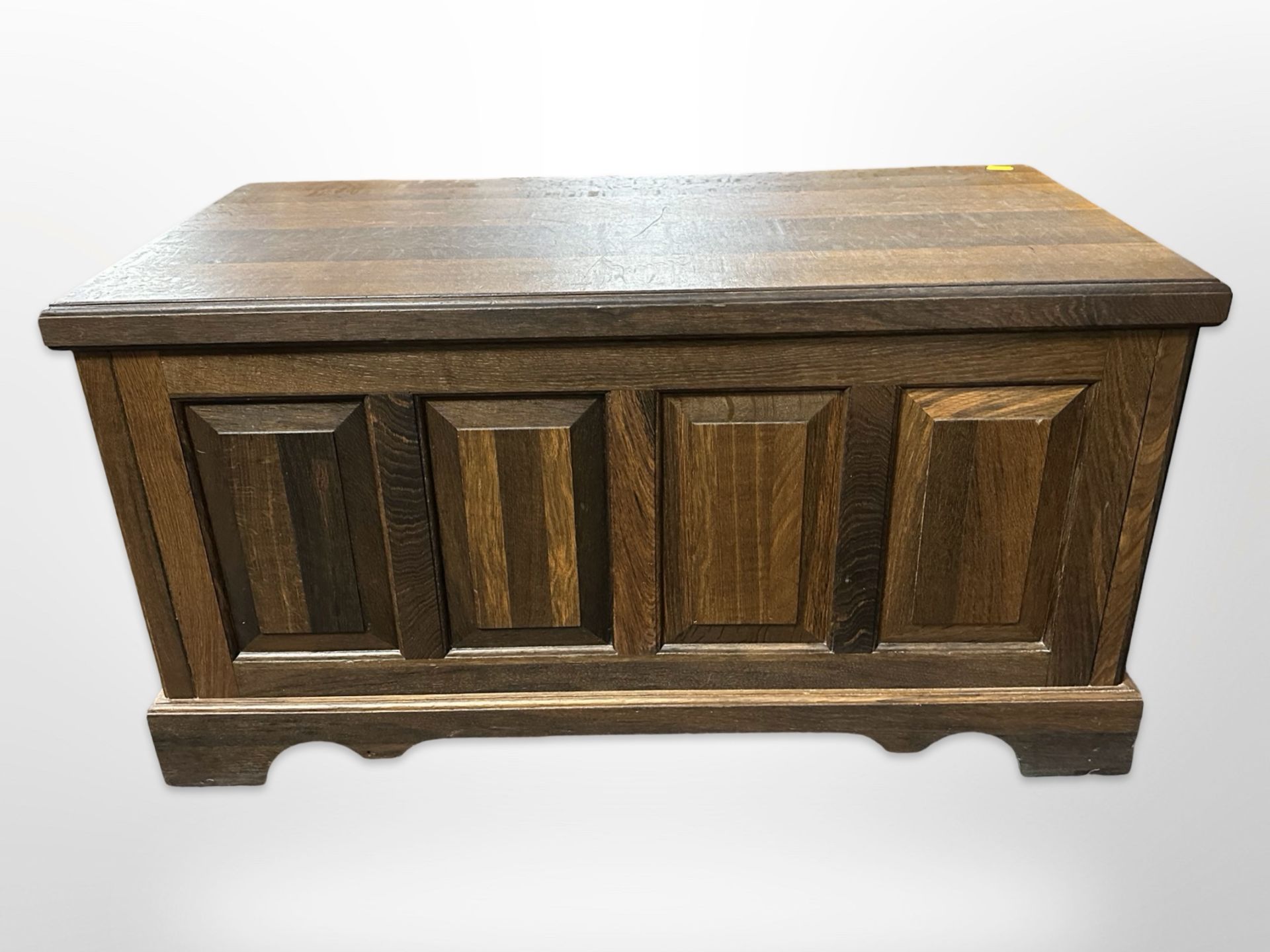 A reproduction panelled oak coffer,