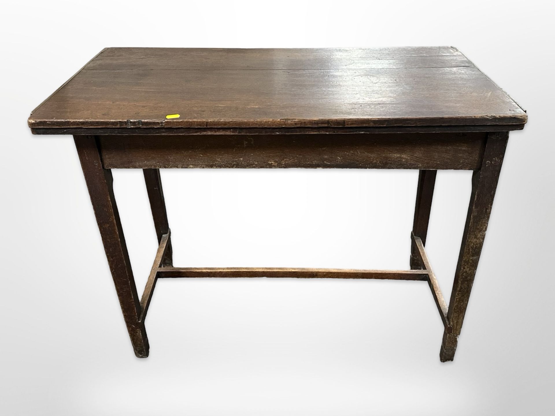 A 19th century oak turn over top table,
