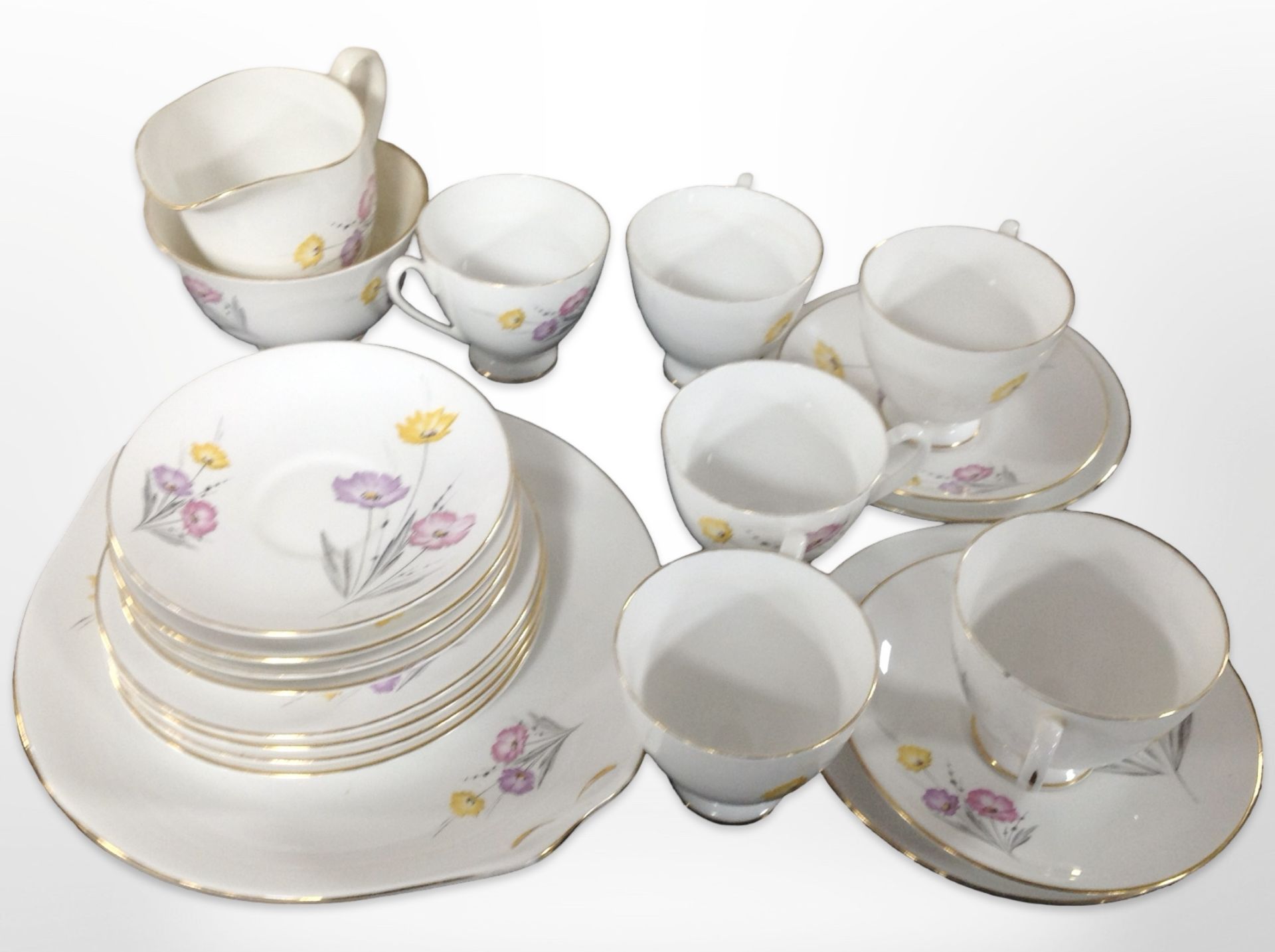 Twenty one pieces of Queen Anne floral decorated tea china