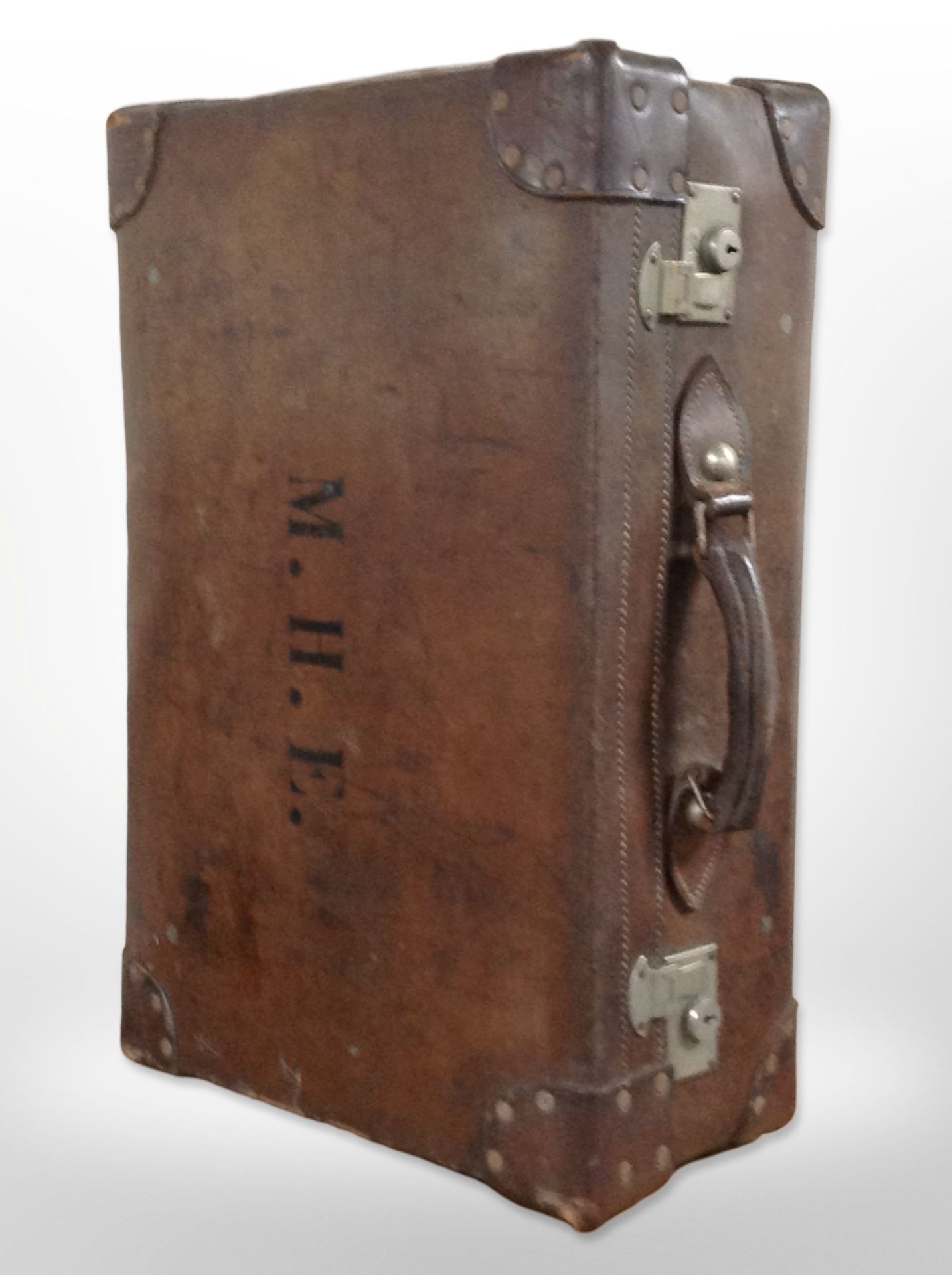 A vintage stitched brown leather luggage case,