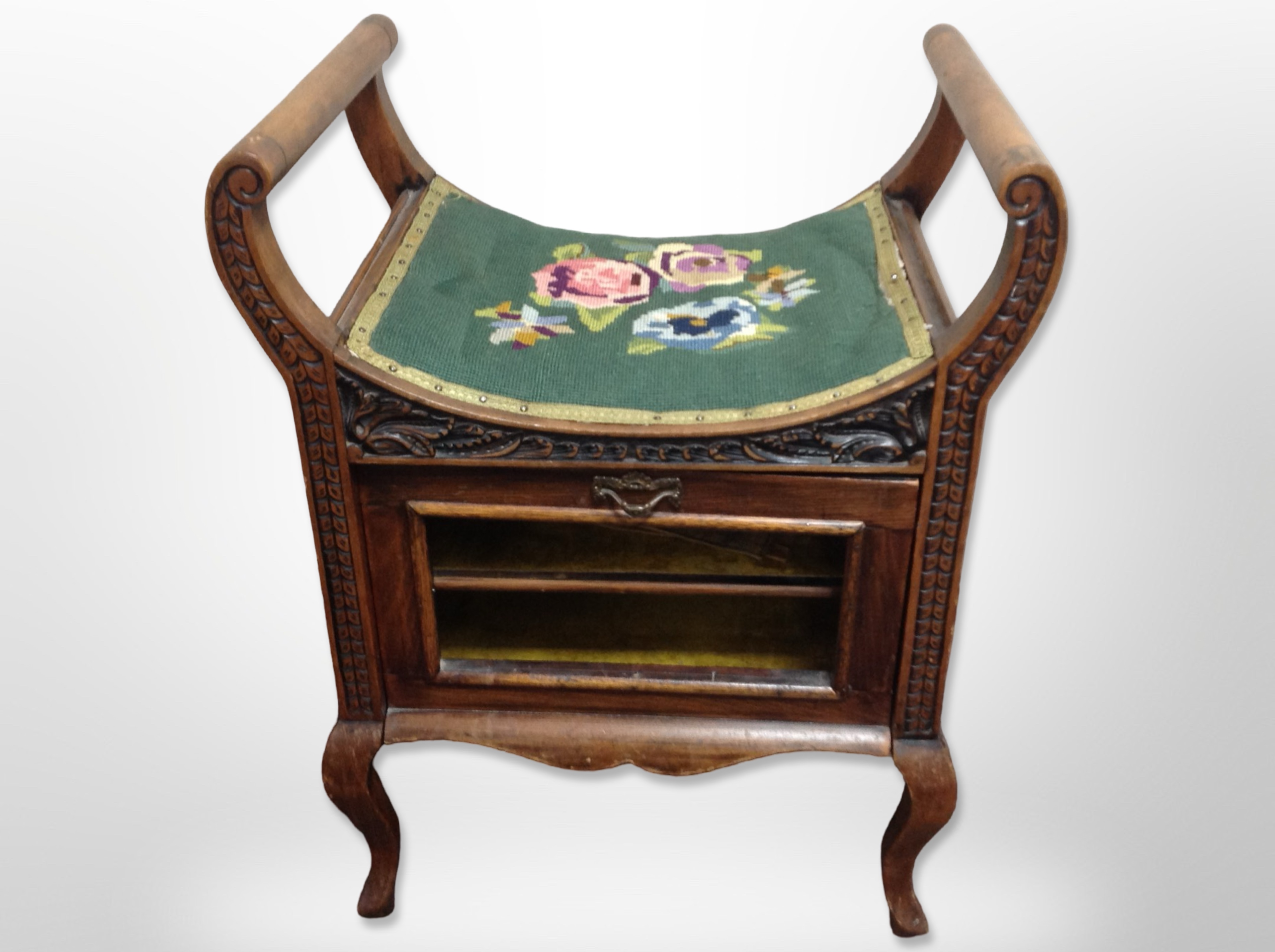 A late Victorian mahogany storage piano stool,