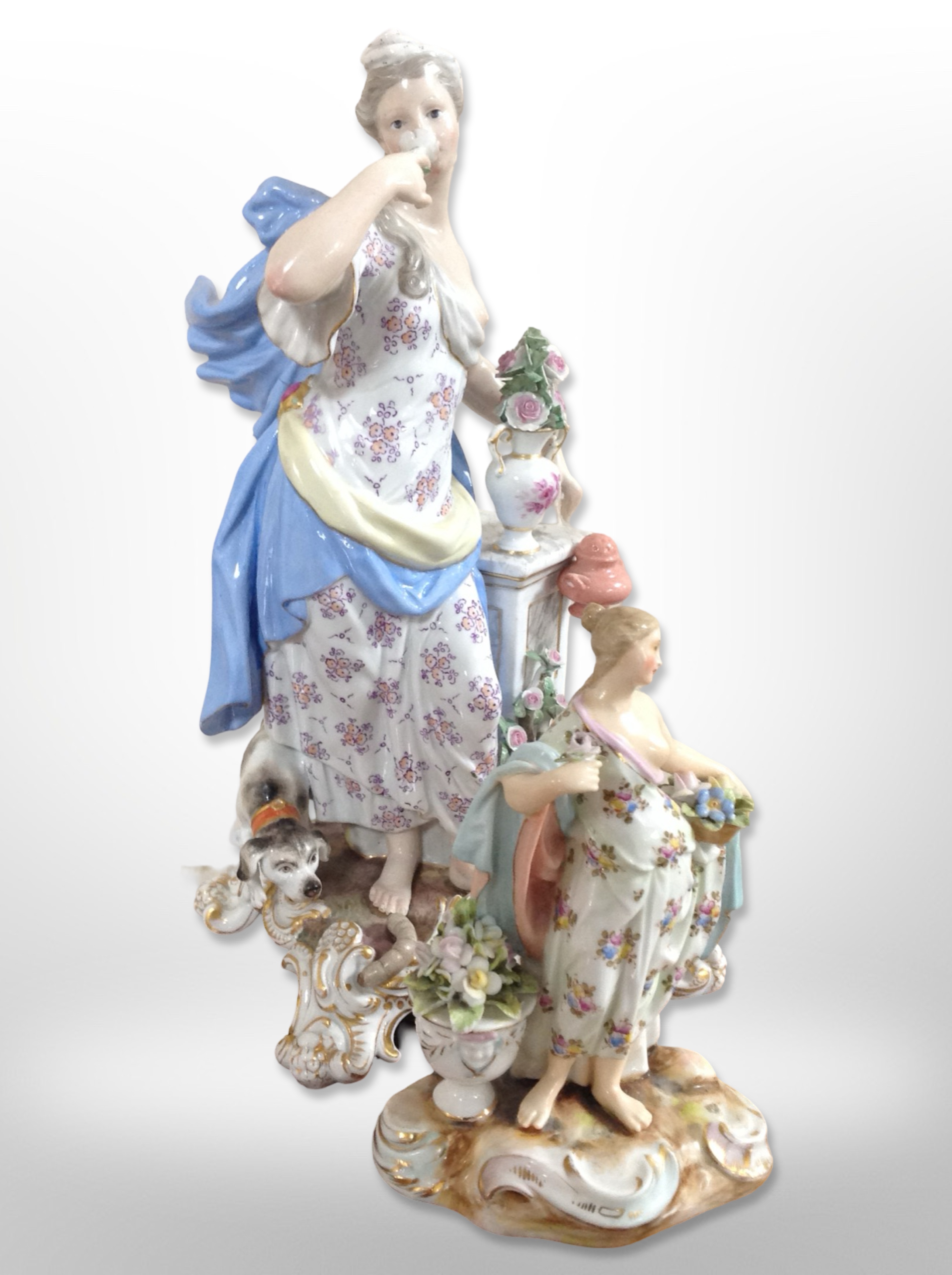 A 20th-century Meissen porcelain figure group of a lady with a cherub and a dog at her feet,