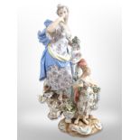 A 20th-century Meissen porcelain figure group of a lady with a cherub and a dog at her feet,