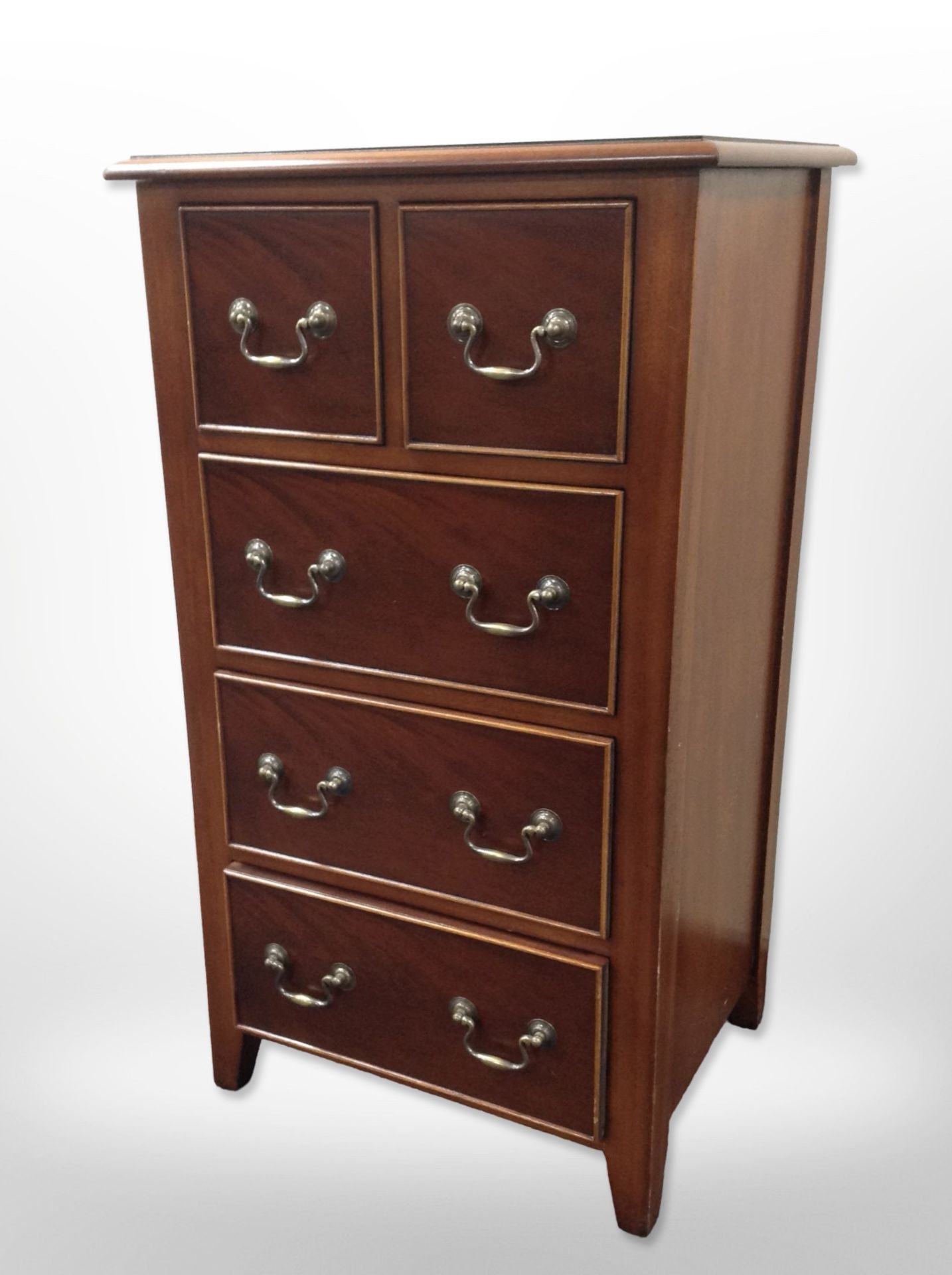 A reproduction mahogany five-drawer chest,