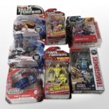 Seven Hasbro Transformers figurines, boxed.
