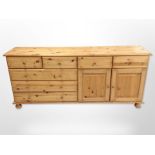 A contemporary pine sideboard,
