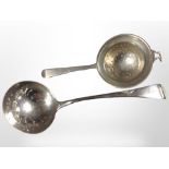 A George III silver straining spoon, length 17.5cm, together with another silver example.