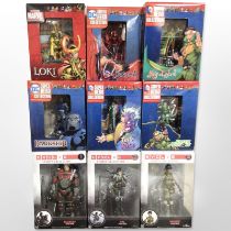 Seven DC Comics superhero figurines, a further Marvel figurine, and a Funko Evolve figurine,