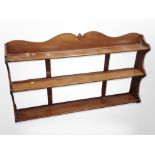 A 20th century mahogany three tier wall shelf,