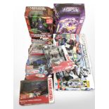 Seven Hasbro and Tomy Transformers figurines, boxed.