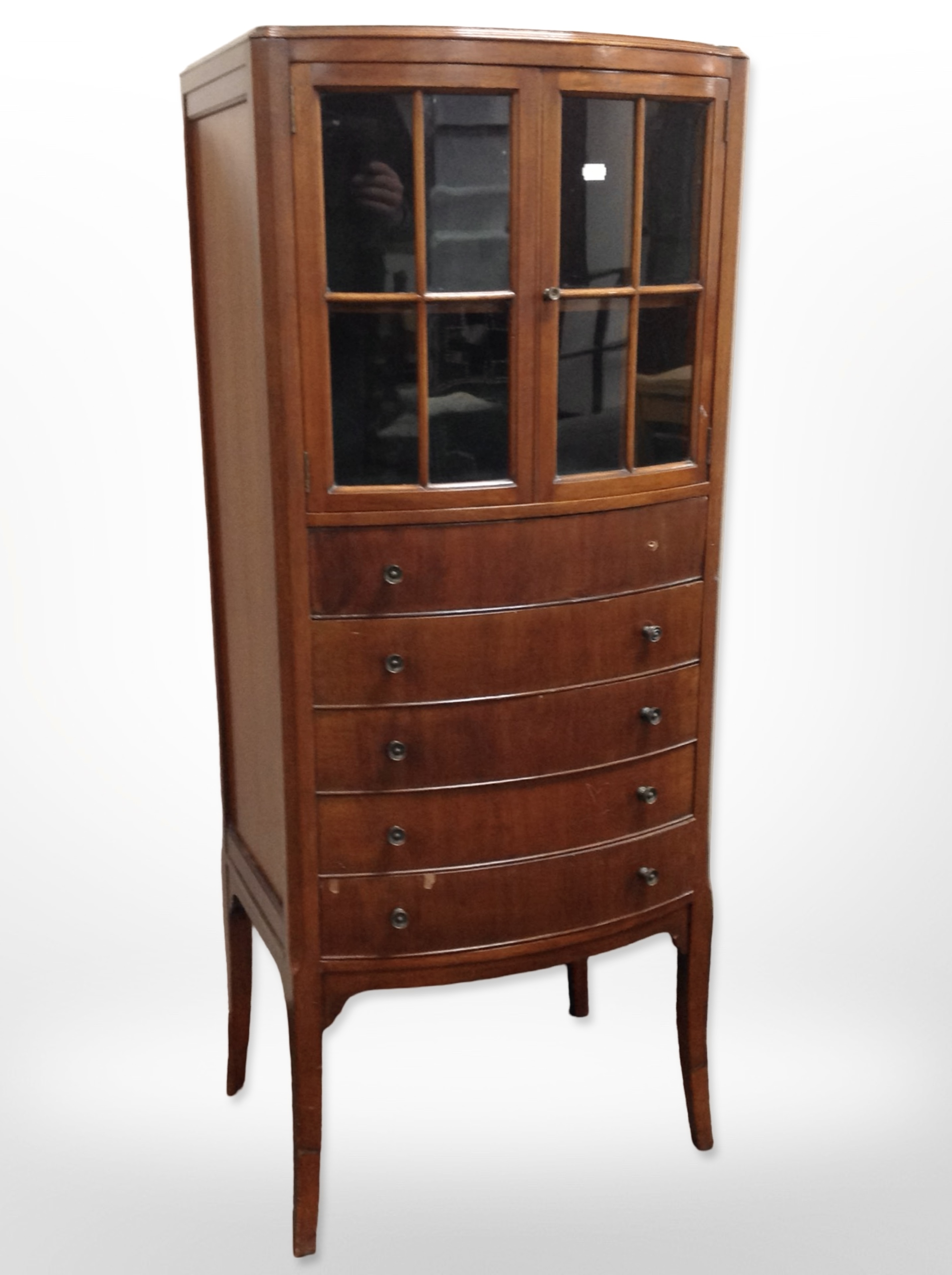 A reproduction mahogany bow-front cabinet,