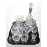 A crystal decanter with plated collar together with a quantity of drinking glasses including