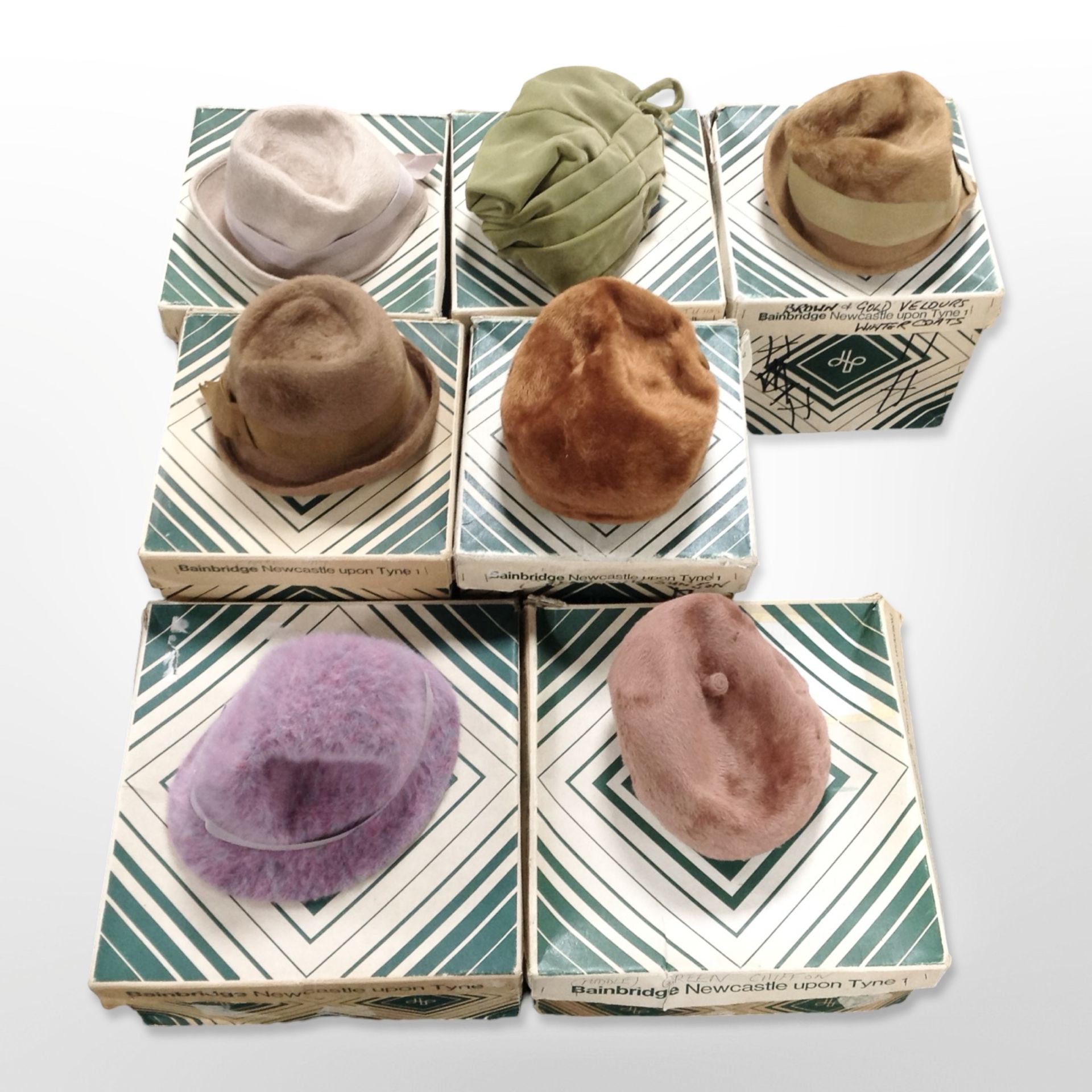 Seven vintage lady's hats in original Bainbridge boxes.