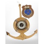 A barometer in the form of a ship's anchor,