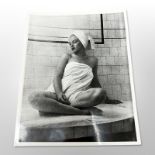 A monochrome photograph depicting Marilyn Monroe in the sauna at the Bel Air Hotel.