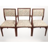 Six contemporary teak framed dining chairs in floral upholstery