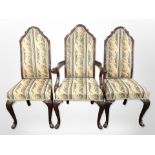 A set of six reproduction mahogany dining chairs on carved pad feet in floral upholstery (two