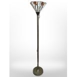 An uplighter with a Tiffany-style shade, height 172cm.