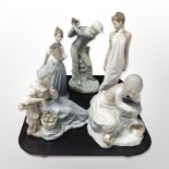 A Lladró figure of a golfer and three Nao figures of ladies and a further Spanish figure of a lady.