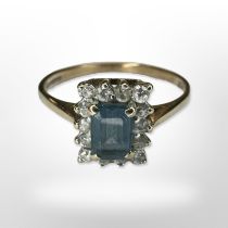 A 9ct yellow gold cluster ring set with synthetic stones,