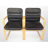 A pair of Kinnarps bentwood and black stitched leather armchairs,