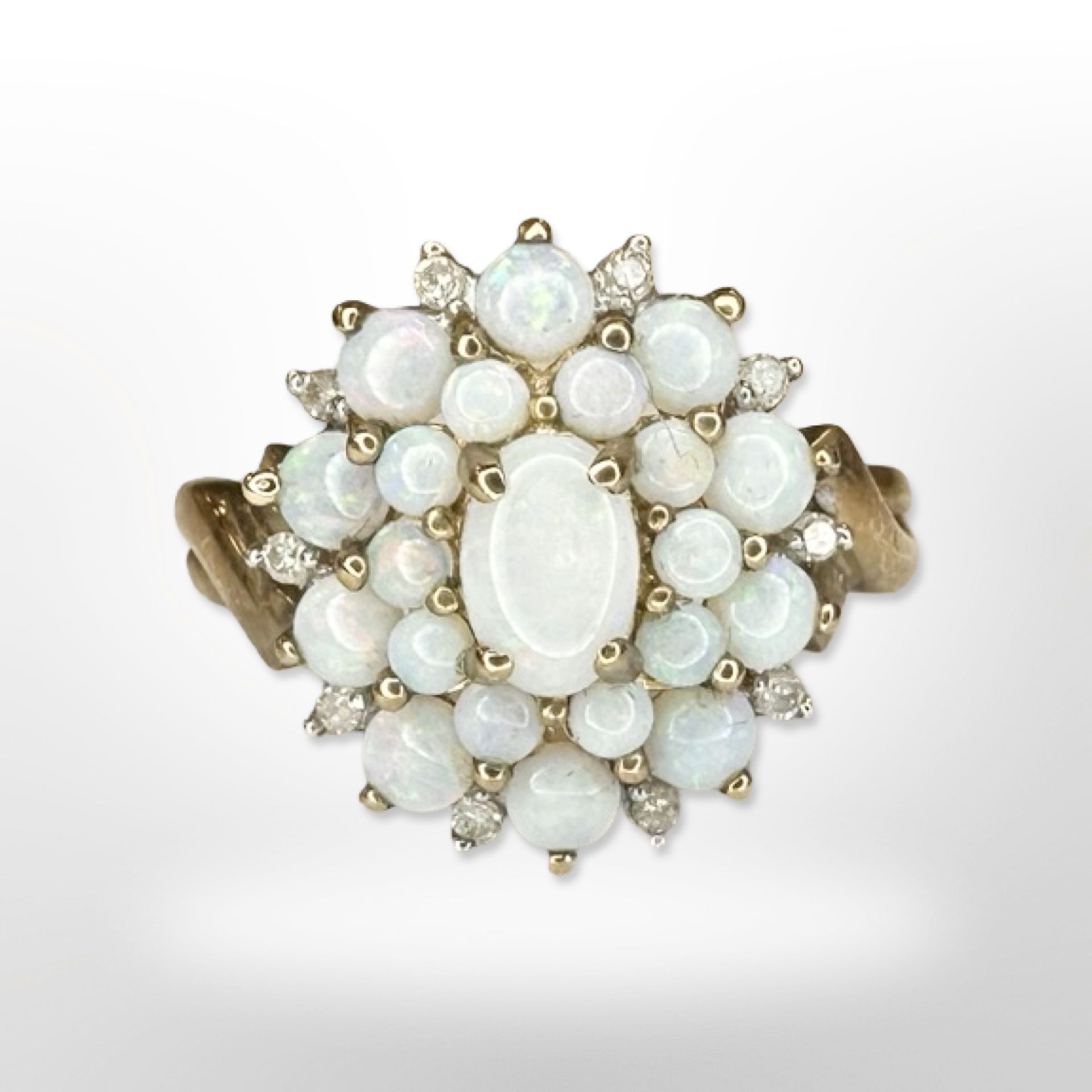 A 9ct yellow gold opal cluster ring, size N/O CONDITION REPORT: 3.1g.