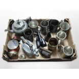 A group of metal wares including 19th-century pewter teapot and tankards, irons,