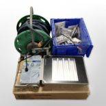 A hose pipe on reel, box containing socket fittings, Loxa light in box.