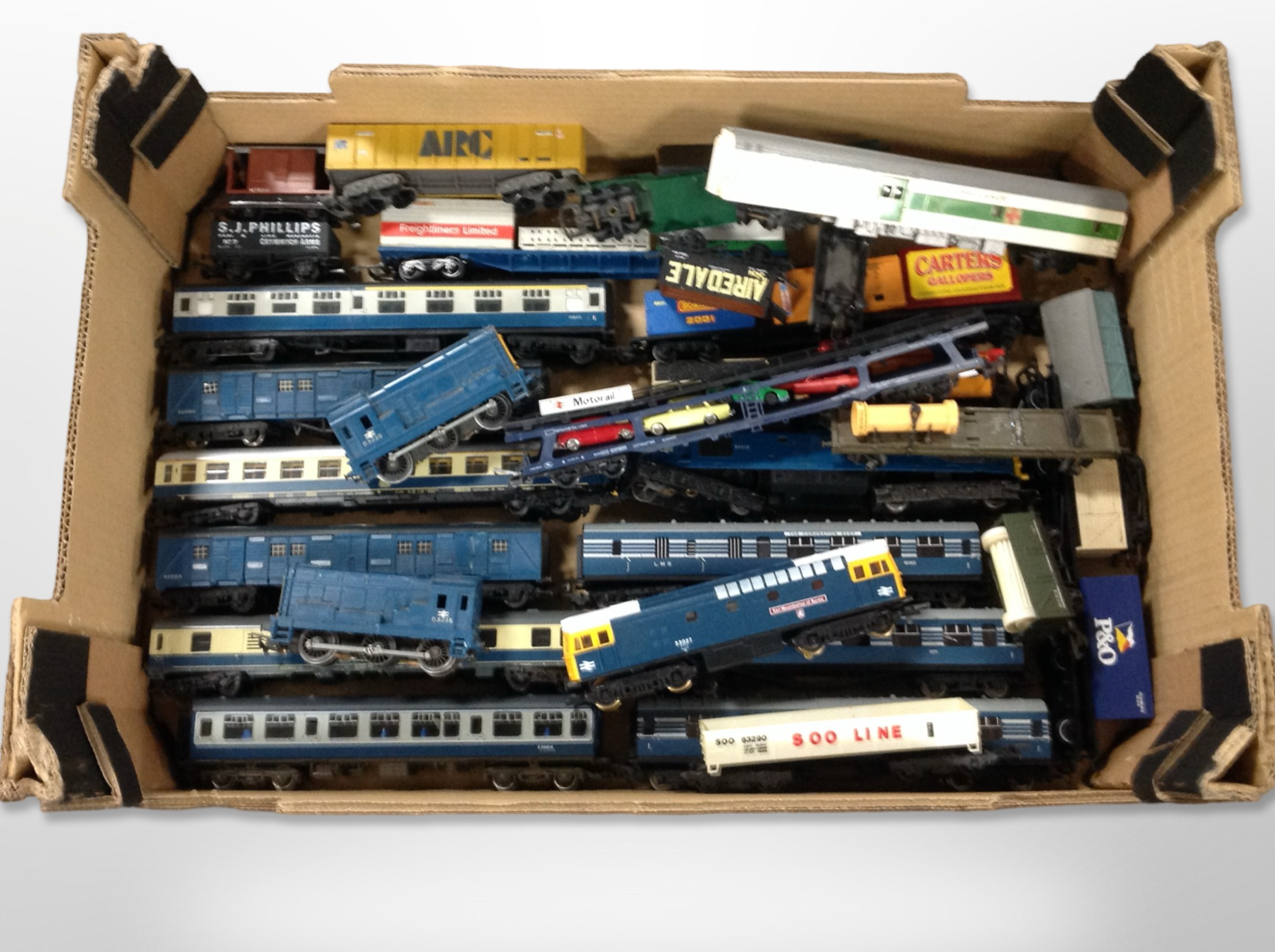 A collection of 00 gauge locomotives and passenger cars, including Lima, Tri-ang, etc.