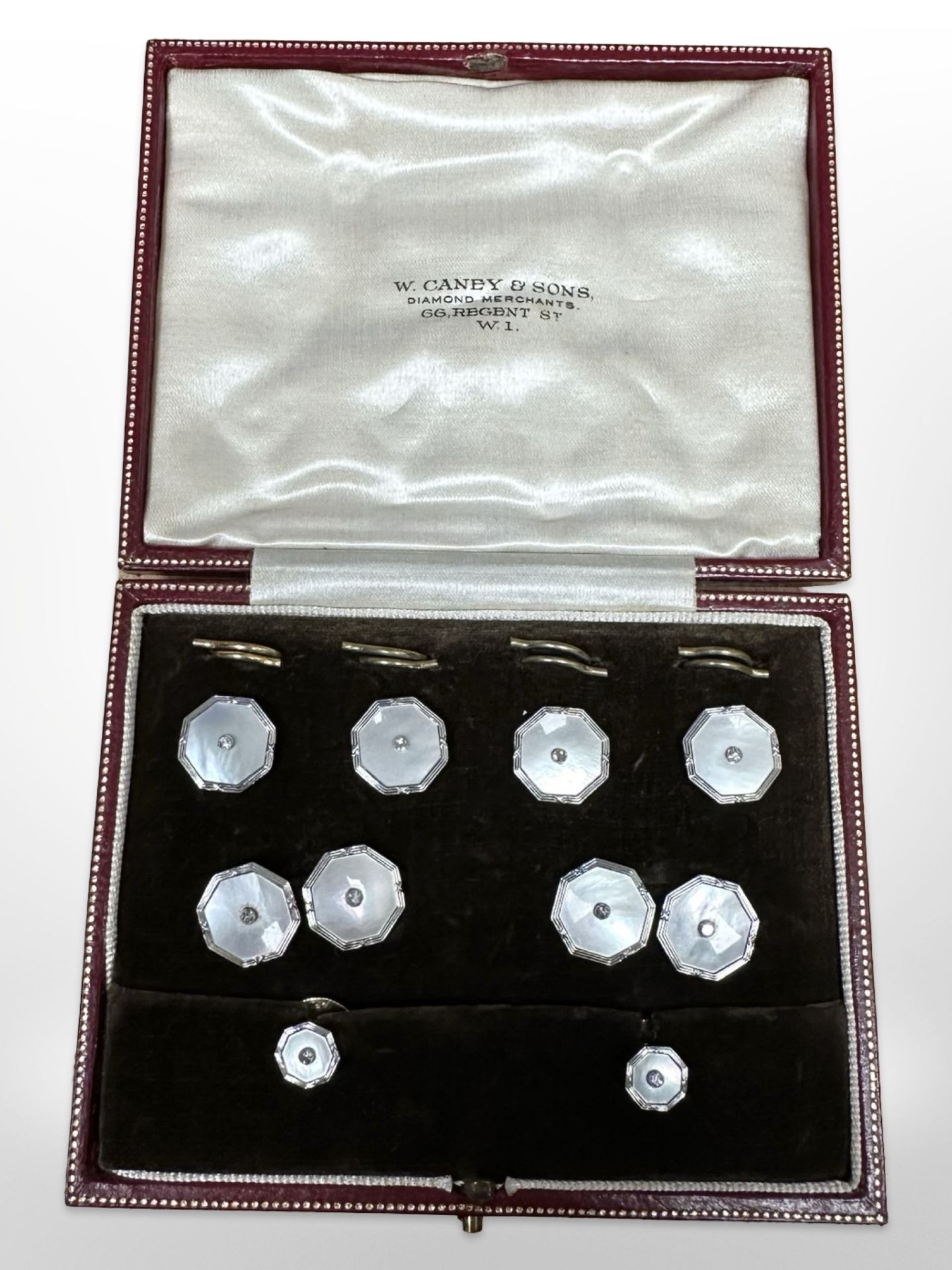 A cased set of 9ct white gold, platinum and diamond studded dress studs with cufflinks,
