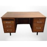 A 20th century teak twin pedestal desk,