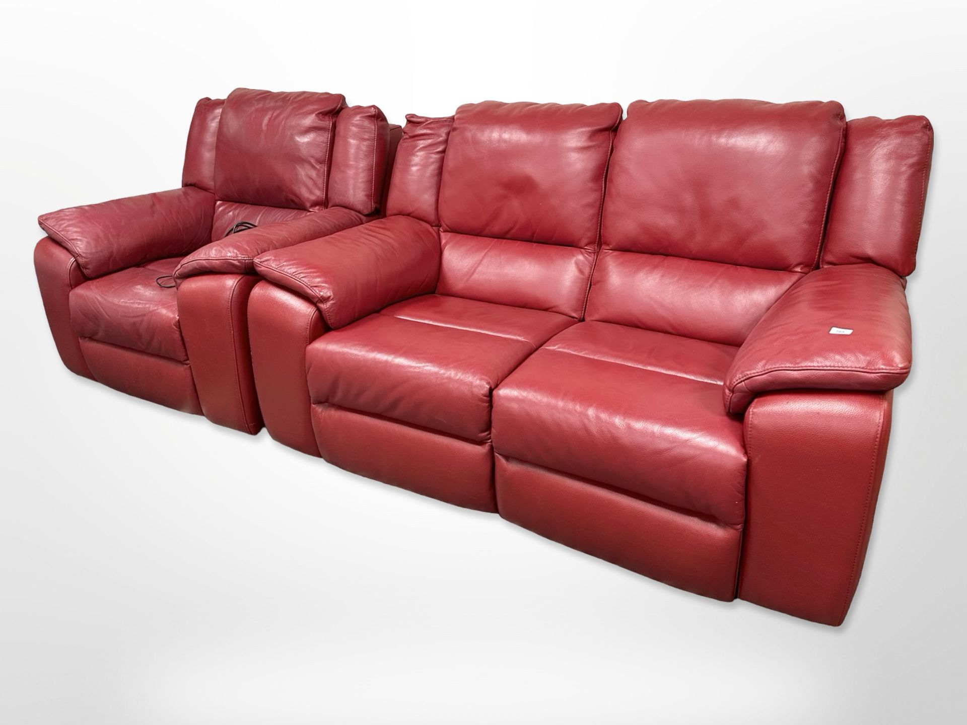 A contemporary red leather electric reclining two-piece suite,