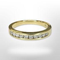 An 18ct yellow gold diamond half eternity ring, size N CONDITION REPORT: 3.8g.