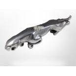 A chrome-plated die-cast metal Jaguar mascot, length 19.5cm.