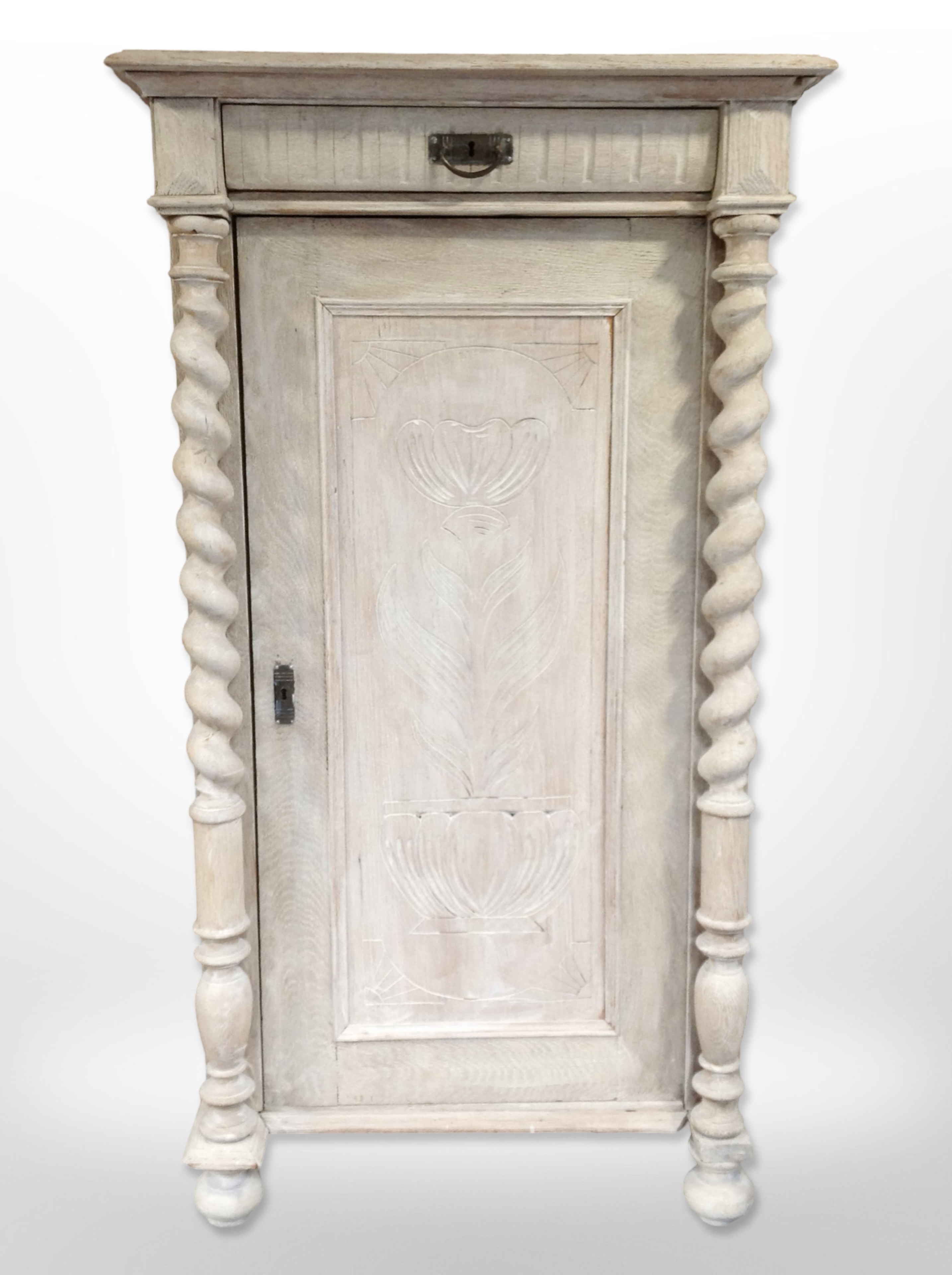 An early 20th century Scandinavian limed oak barleytwist sentry door cabinet,