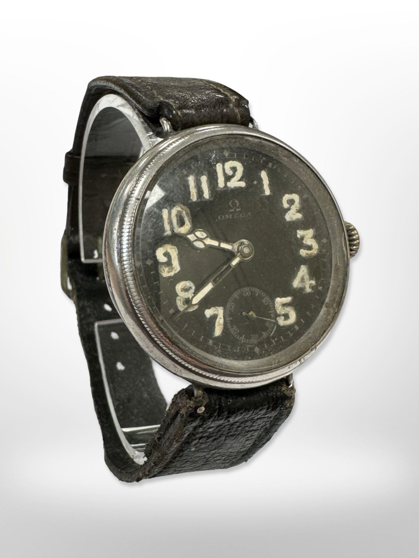 An Omega trench wristwatch, black dial with luminous Arabic numerals and hands, subsidiary seconds,