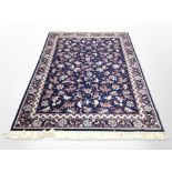 A machine made Persian design rug,