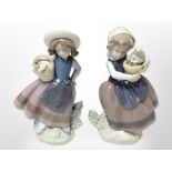 Two Lladró figures of girls carrying baskets of flowers, height 18cm.