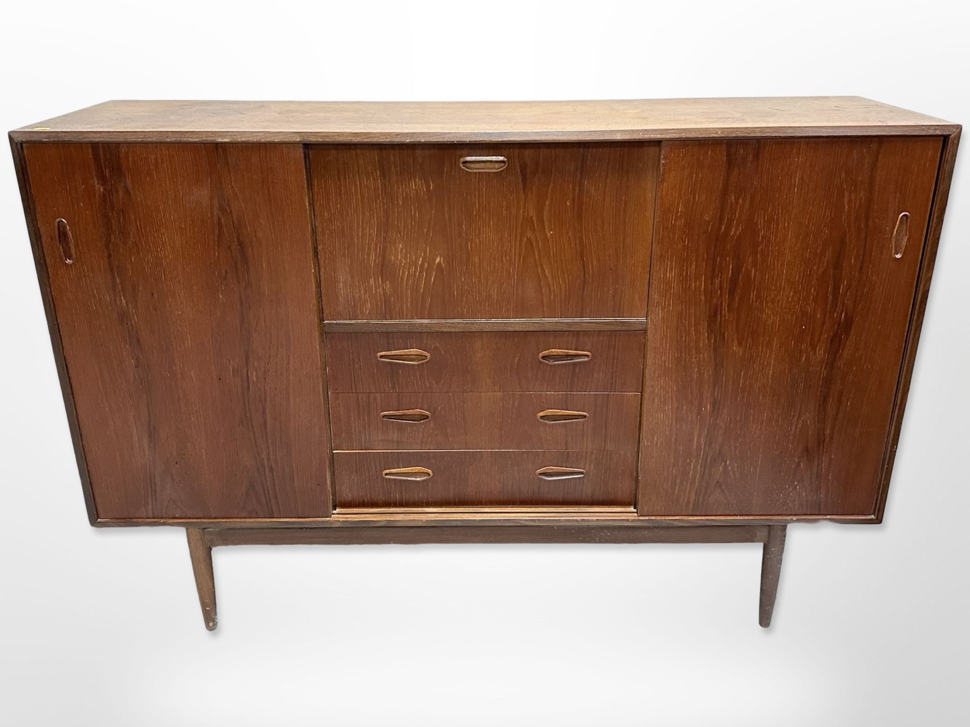 A 20th century Danish teak sliding door sideboard,