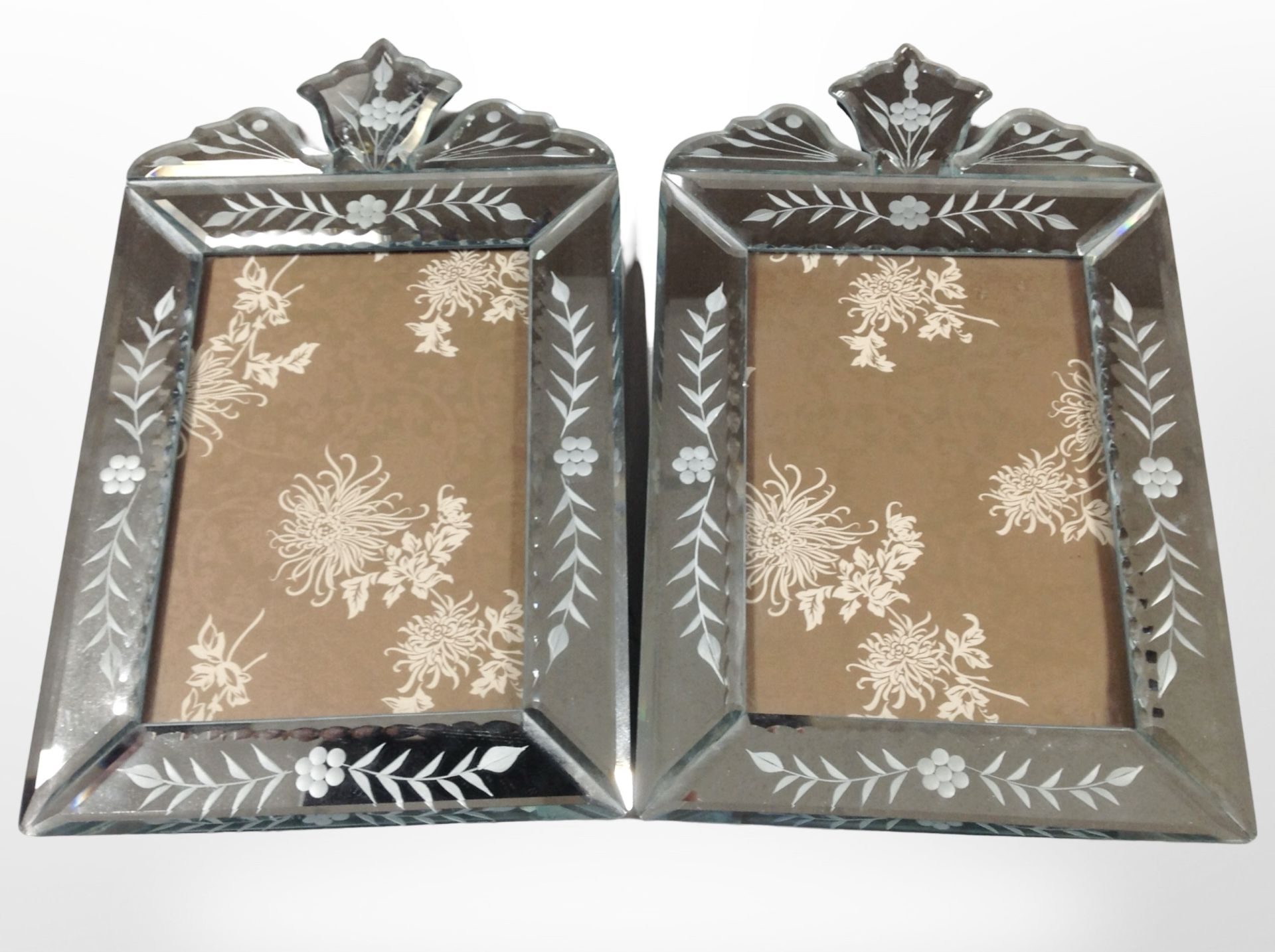 A pair of 20th century Venetian etched and bevelled glass picture frames,